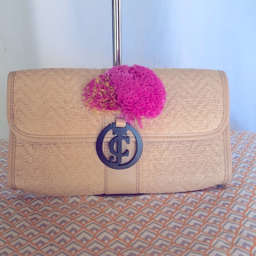 JUICY COUTURE tan and pink straw clutch bag. Pink straw poms poms attached.